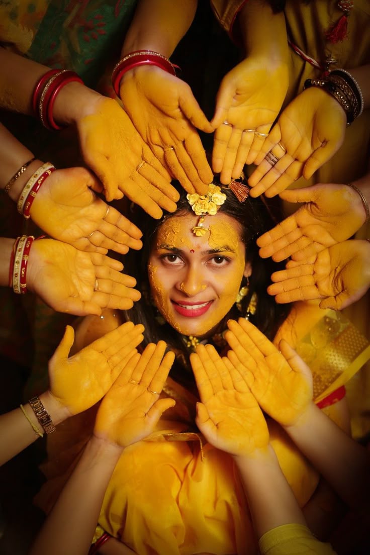 Bride covered in haldi during traditional photoshoot